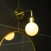 Florens vegglampe IP44 messing/opal